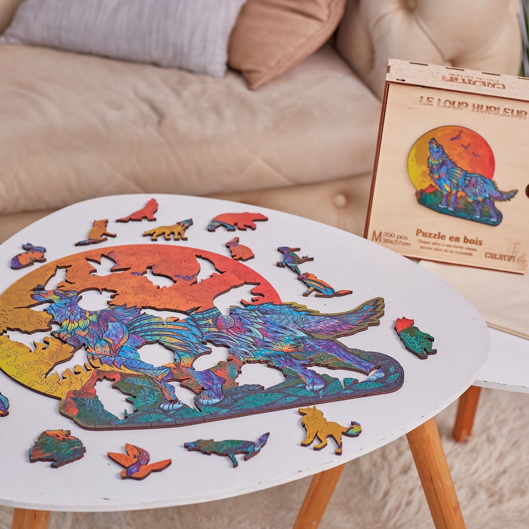Colorful wolf puzzle on a table with packaging in the background