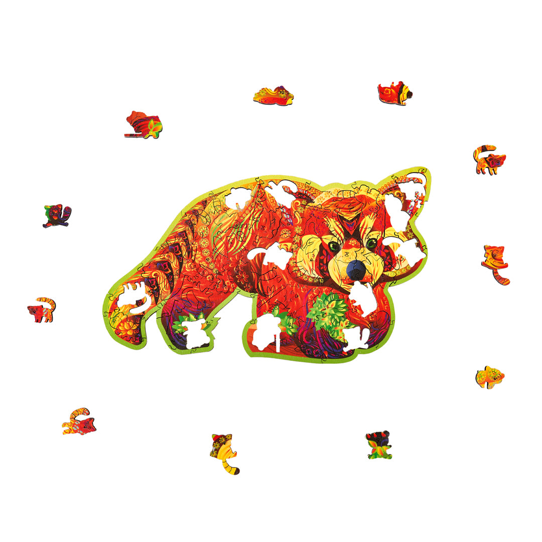Colorful red panda shaped wooden puzzle with pieces scattered on a white background